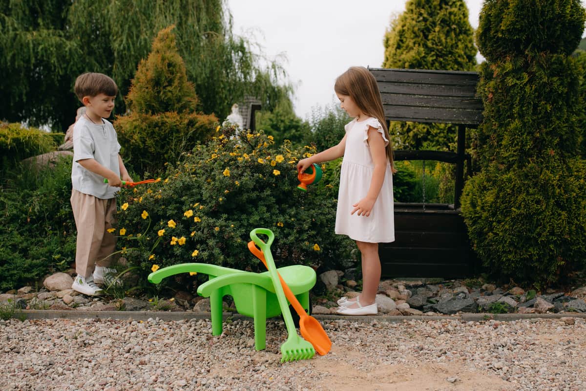 Children and adults playing a lawn game together safely