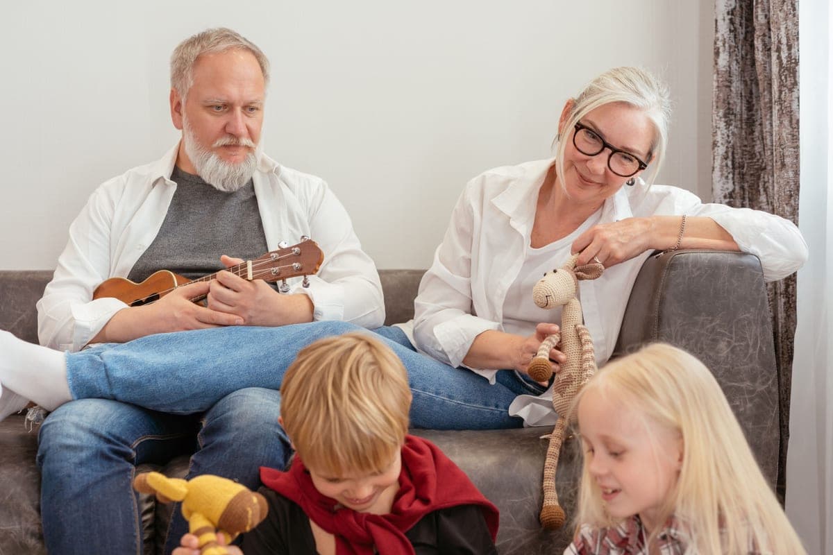 A family of different ages playing together in a garden